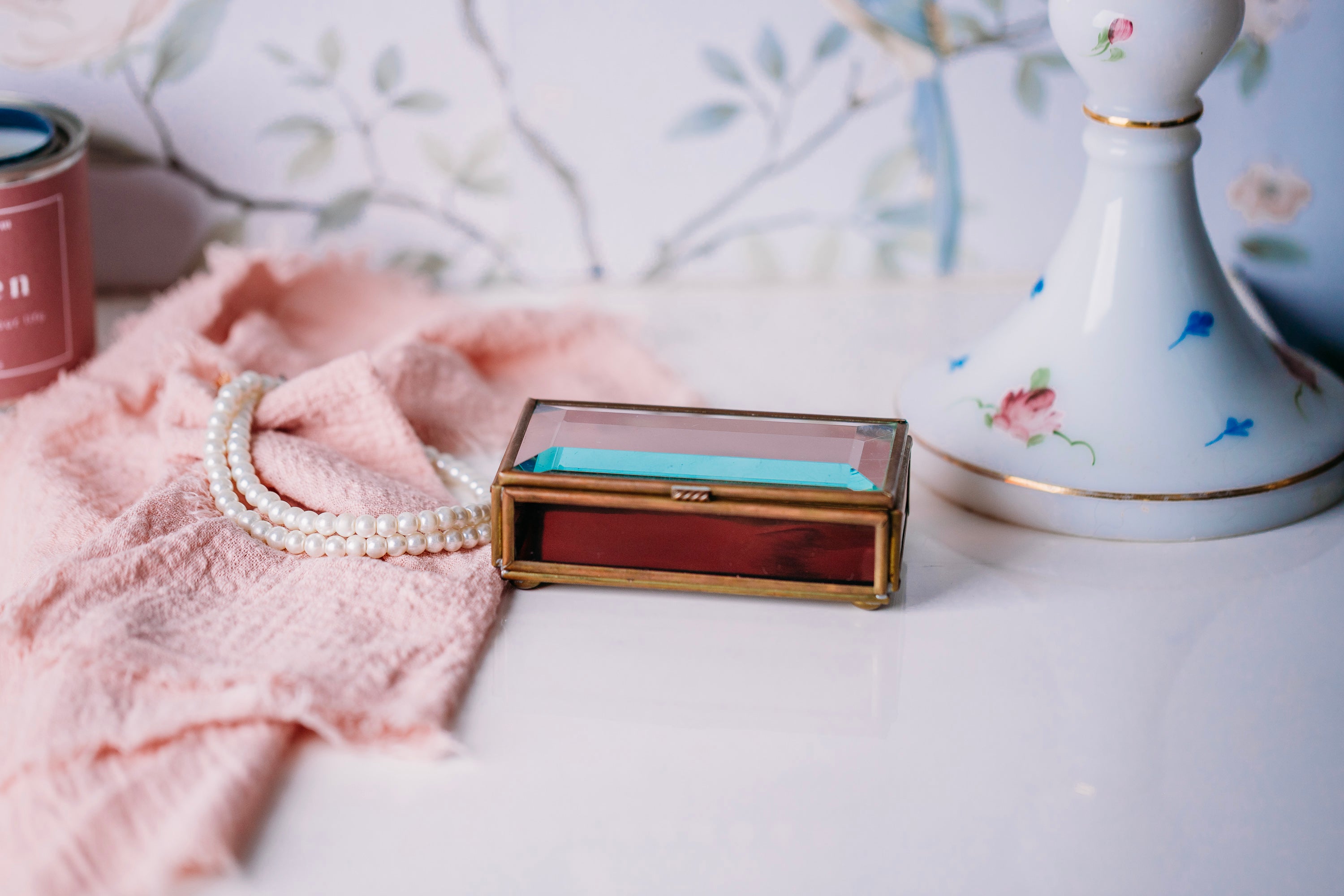 Vintage Via Vermont glass jewelry box with handmade Mexican design on a white countertop.