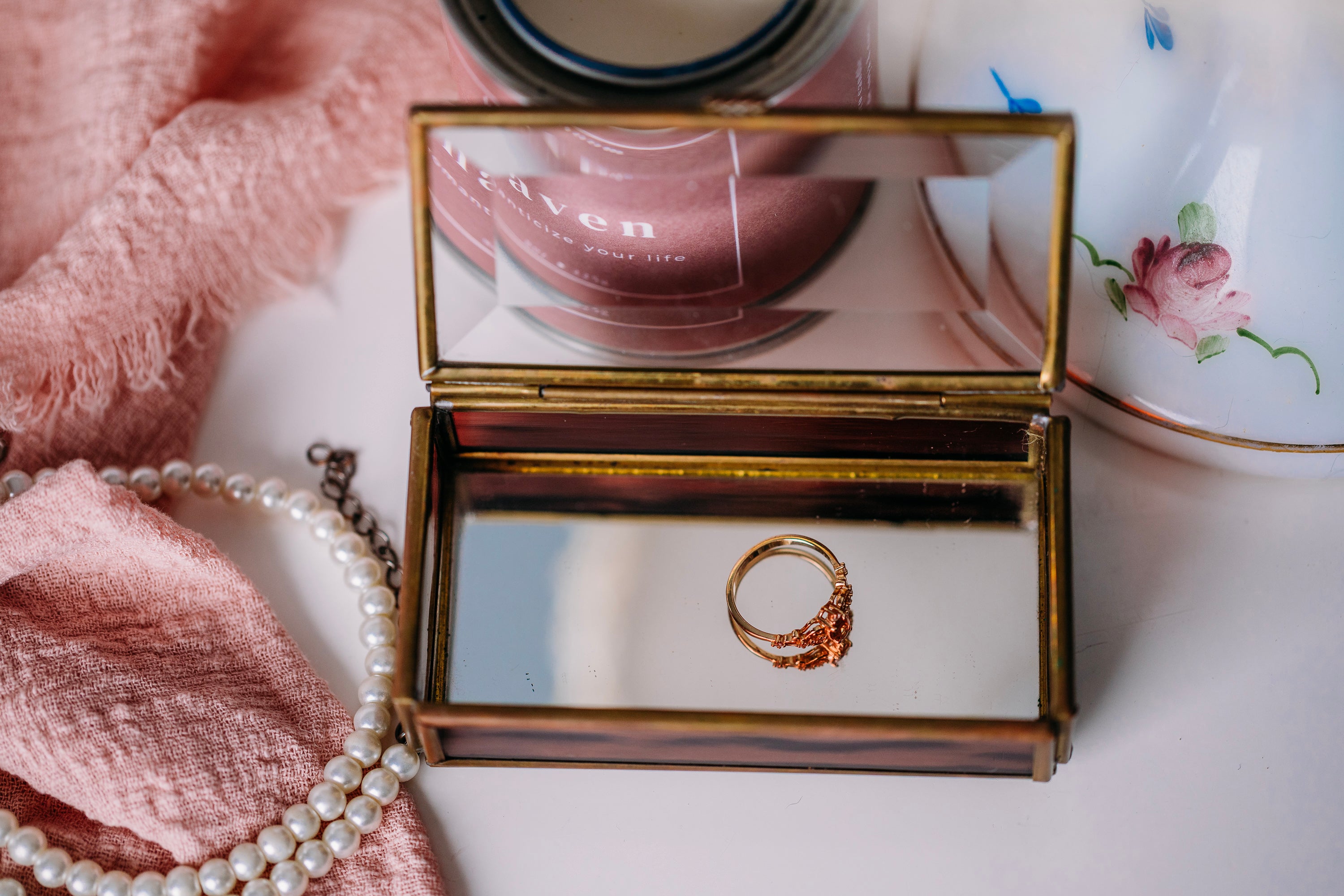 Elegant vintage Via Vermont glass trinket box with handmade Mexican artwork on white surface.