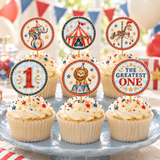 Vintage circus first birthday cupcake toppers displayed on frosted cupcakes with red and blue bunting in the background.