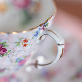 Close-up of a decorative teacup with floral patterns