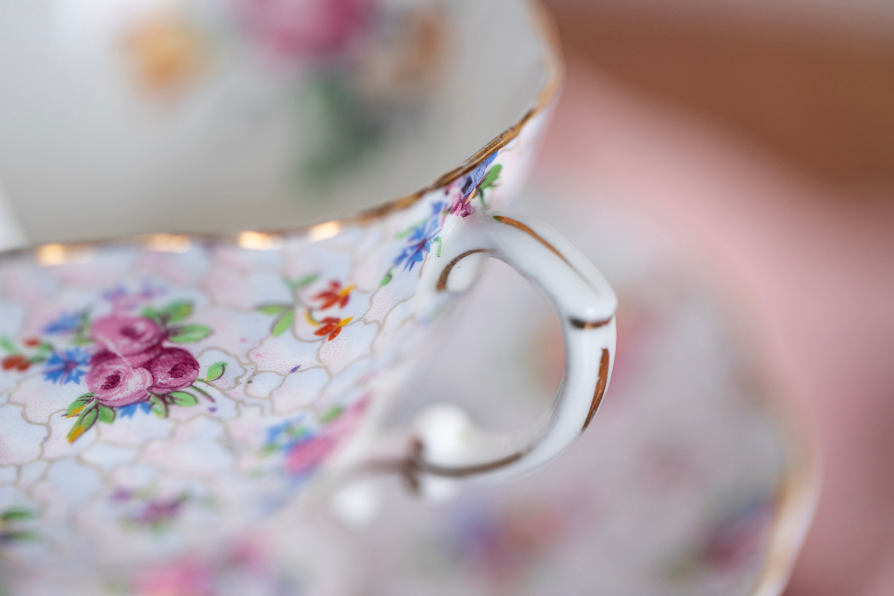 Close-up of a decorative teacup with floral patterns