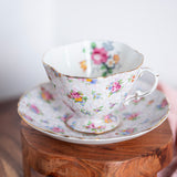 Vintage Hammersley floral chintz teacup and saucer made in England on wooden surface