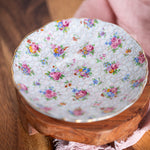 Romantic vintage English teacup with delicate chintz flower pattern