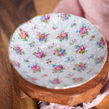Romantic vintage English teacup with delicate chintz flower pattern