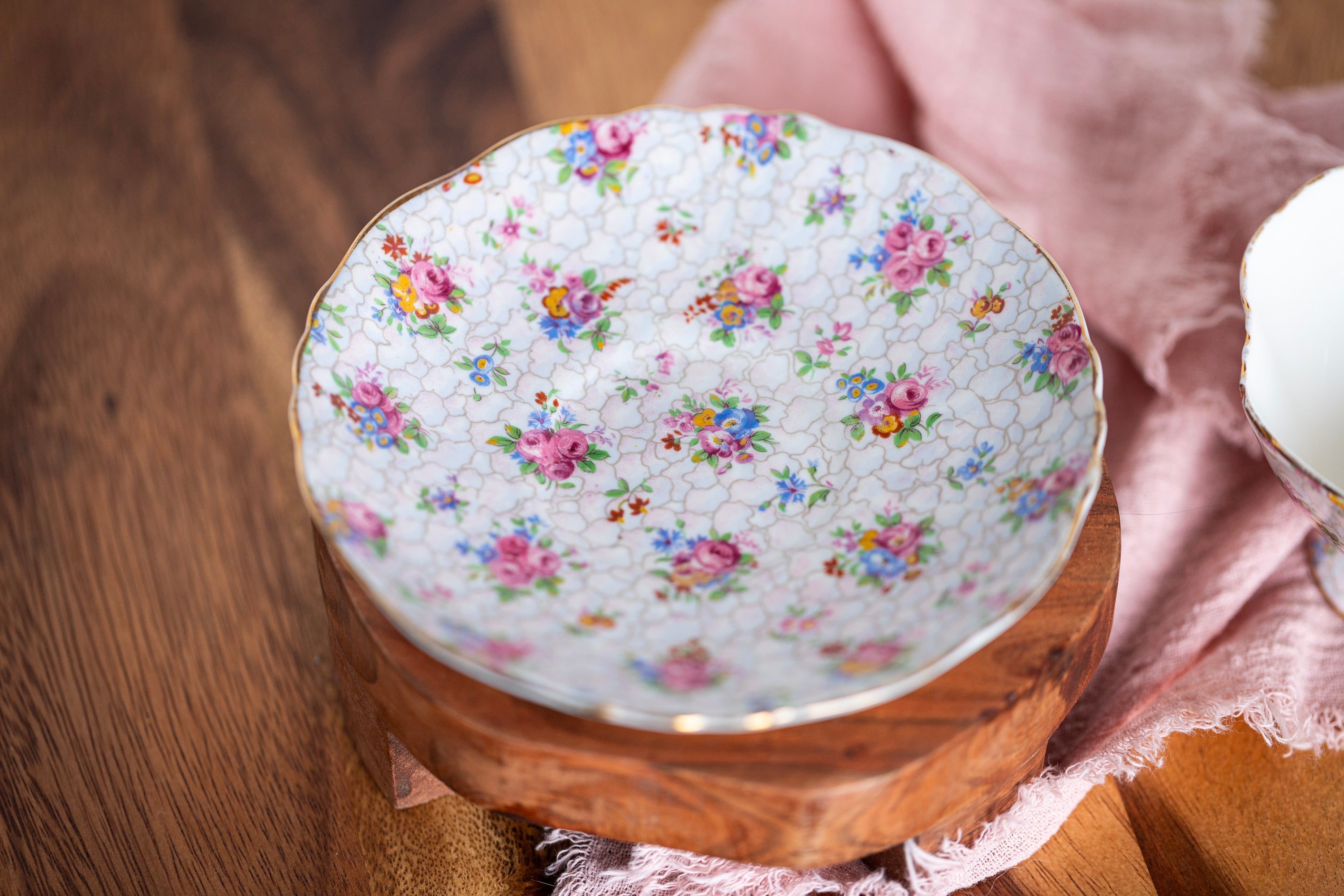 Romantic vintage English teacup with delicate chintz flower pattern