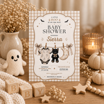Beige gingham Halloween baby shower invitation standing beside a plush ghost, candle, knitted pumpkins and wooden baby blocks.