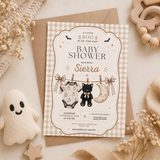 A Little Boo Halloween baby shower invitation with beige gingham, a black kitten and ghost details, arranged on a kraft envelope.