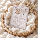 Little Boo Halloween baby shower invitation displayed in a cozy basket with soft blankets