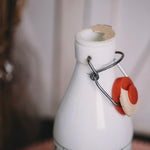 1970s Cerve Italian glass milk bottle close-up, ap open