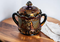 Antique Northwood carnival glass biscuit jar in electric amethyst purple with grape and cable pattern