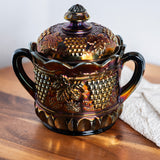 Antique Northwood carnival glass biscuit jar in electric amethyst purple with grape and cable pattern