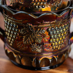 Vintage Northwood carnival glass jar with grape and cable embossed pattern