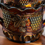 Vintage Northwood carnival glass jar with grape and cable embossed pattern