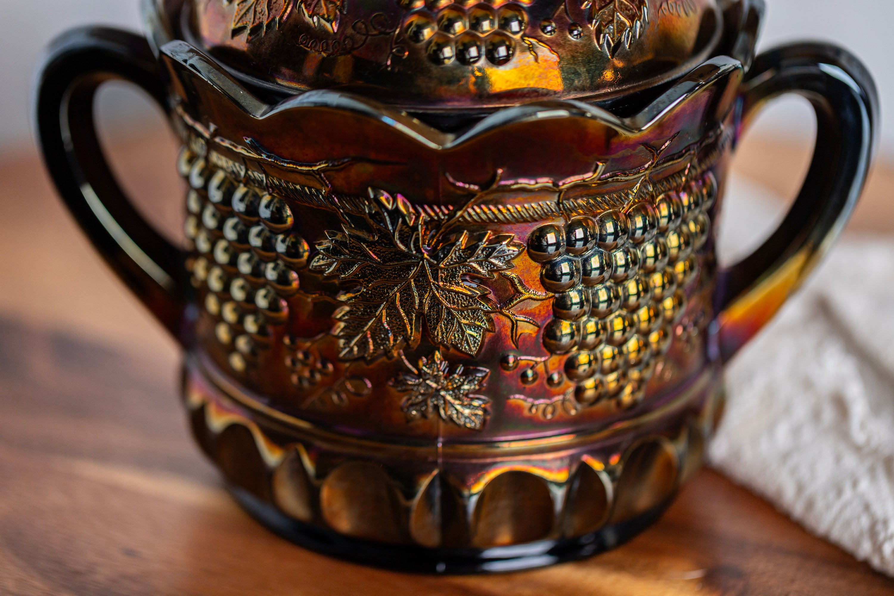 Vintage Northwood carnival glass jar with grape and cable embossed pattern