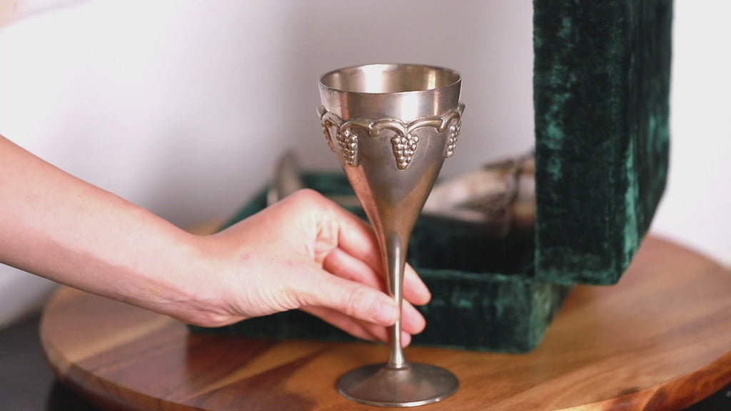 Set of two vintage brass wine glasses with velvet case