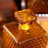 Vintage amber bottle with textured diamond glass design