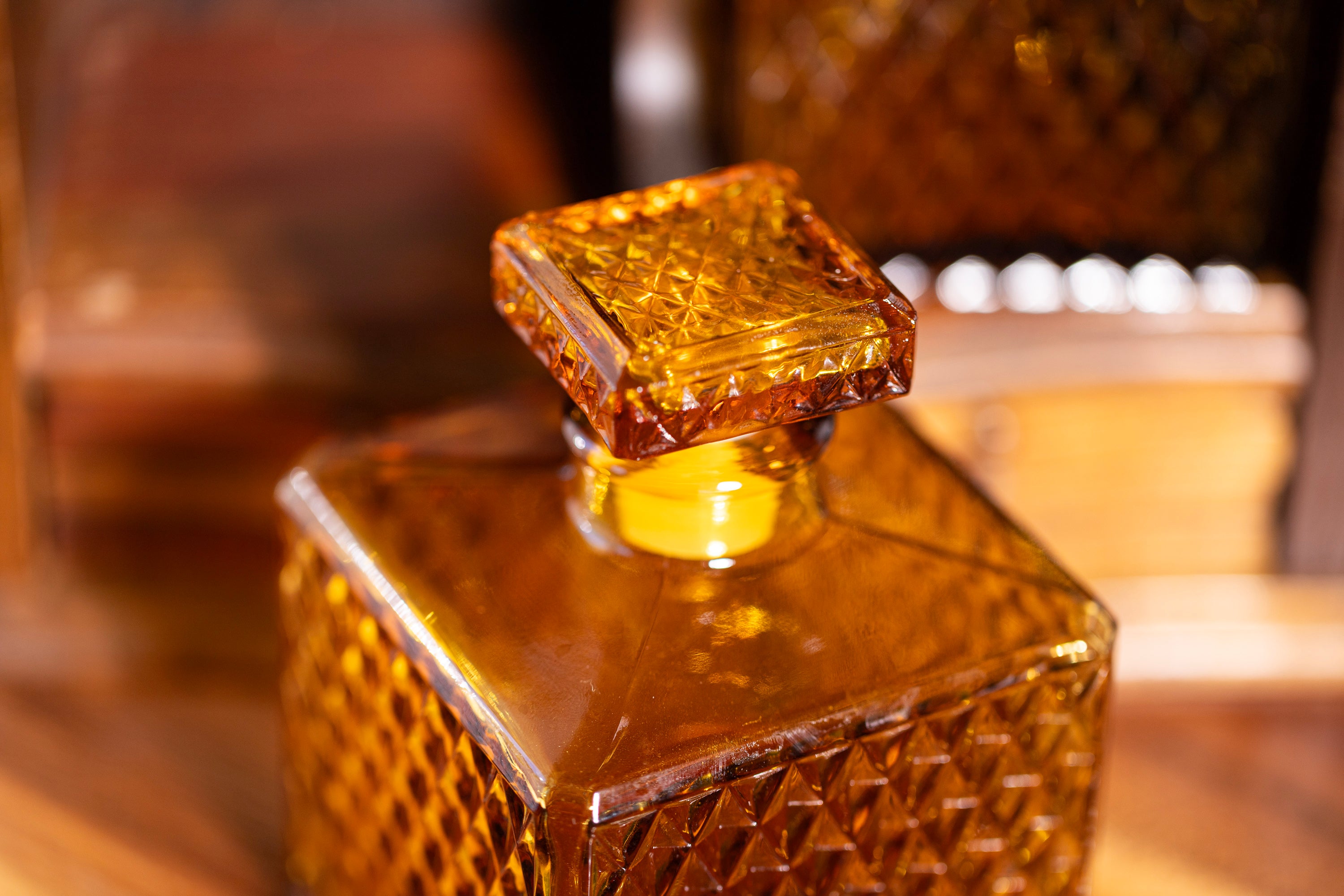 Vintage amber bottle with textured diamond glass design