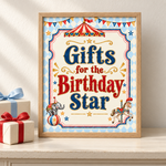 Oak-framed “Gifts for the Birthday Star” vintage circus sign beside cream gift boxes tied with red and blue ribbons.