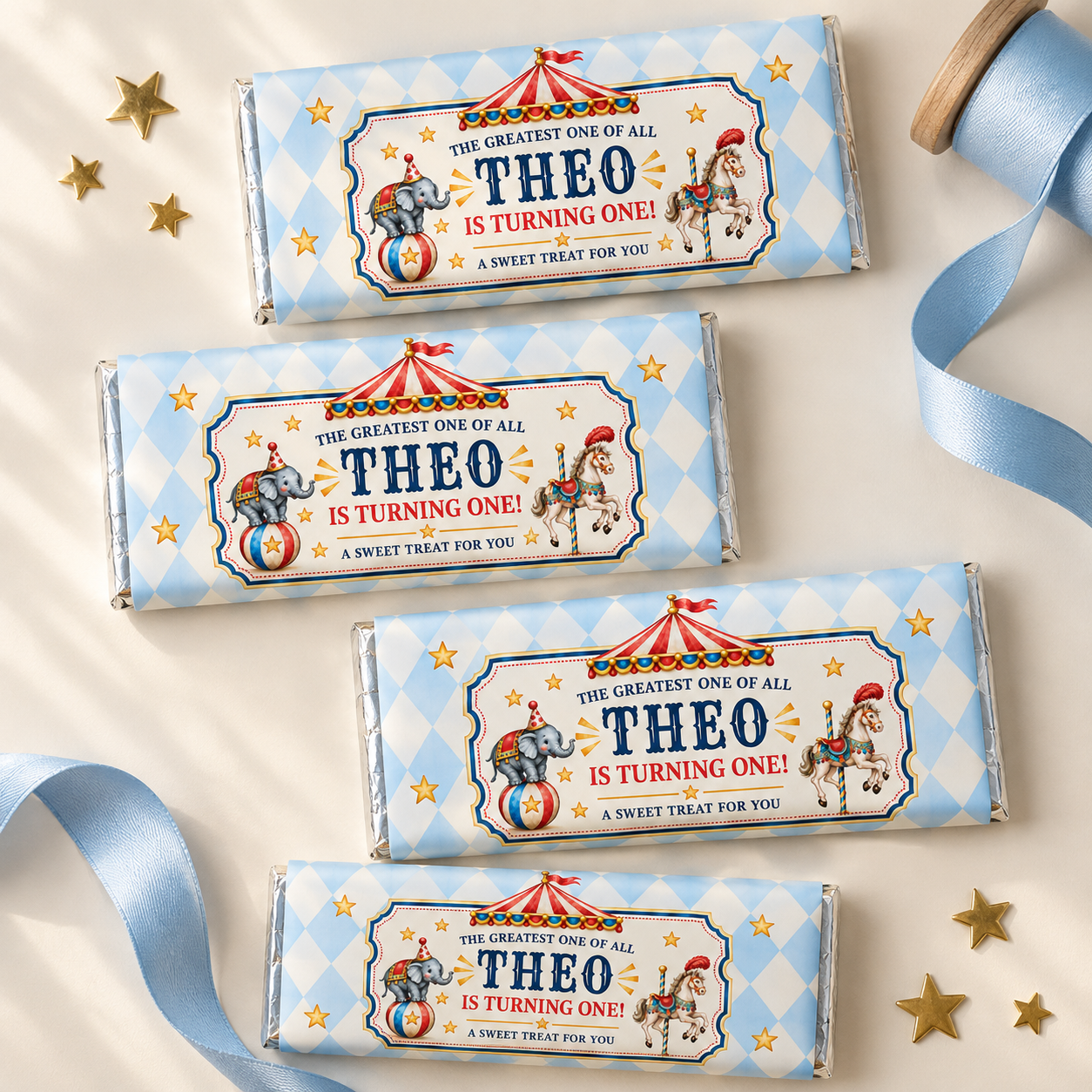 Four chocolate bars with blue diamond circus wrappers and personalized birthday text, arranged beside blue ribbon and gold stars.