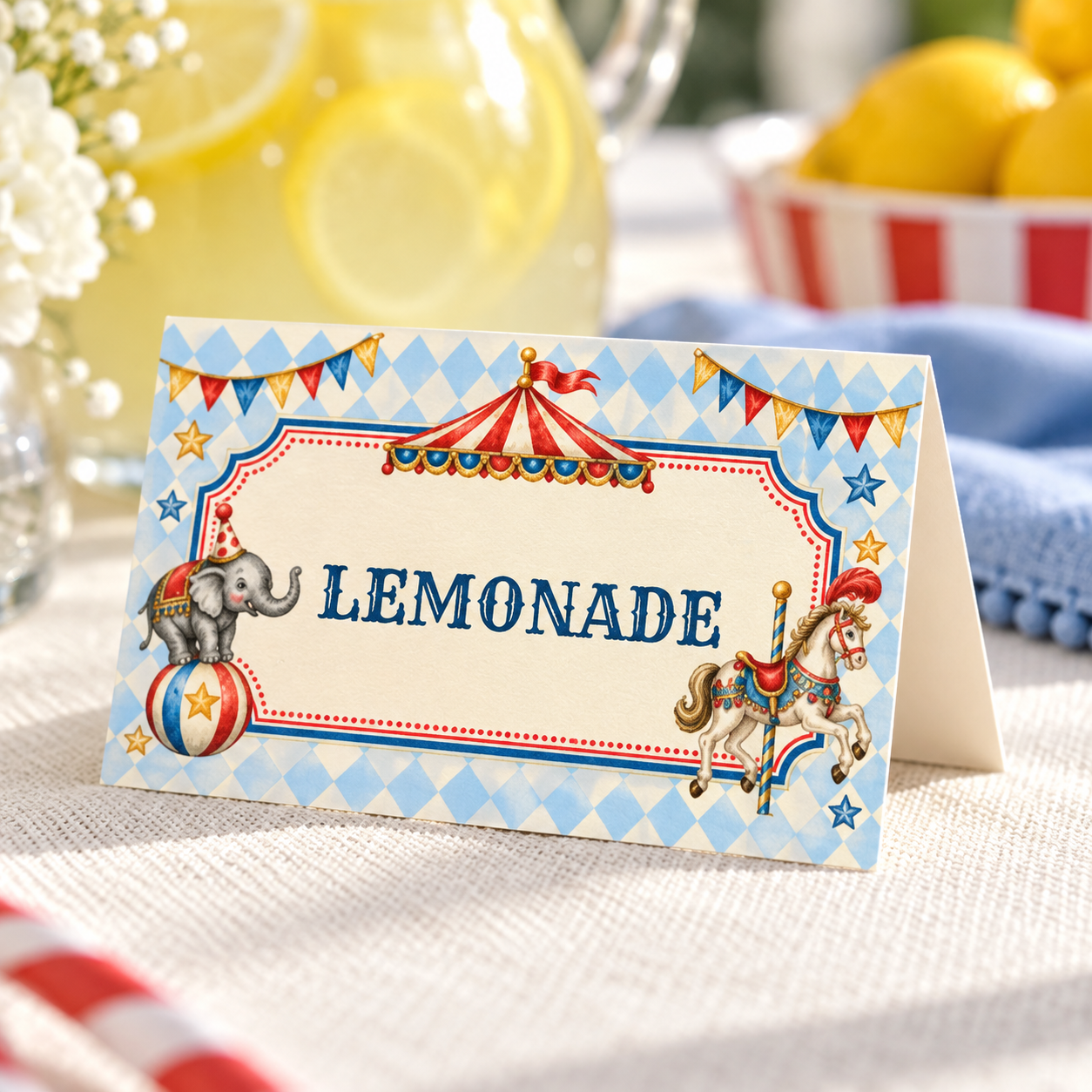 Close-up of a folded circus lemonade food label showing the decorative border, elephant, carousel horse and cream cardstock.