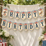 Vintage circus Happy Birthday banner hanging against a cream backdrop outdoors, surrounded by greenery.