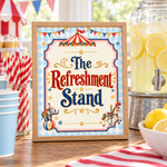 Oak-framed “The Refreshment Stand” circus sign beside a lemonade dispenser, blue cups and red striped straws.