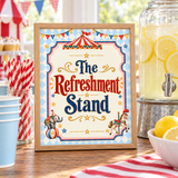 Oak-framed “The Refreshment Stand” circus sign beside a lemonade dispenser, blue cups and red striped straws.