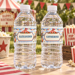 Water bottles labeled “Alexander” and “Catherine” on a vintage circus party table with popcorn and bunting.