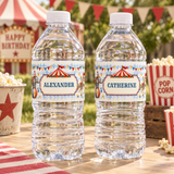Water bottles labeled “Alexander” and “Catherine” on a vintage circus party table with popcorn and bunting.