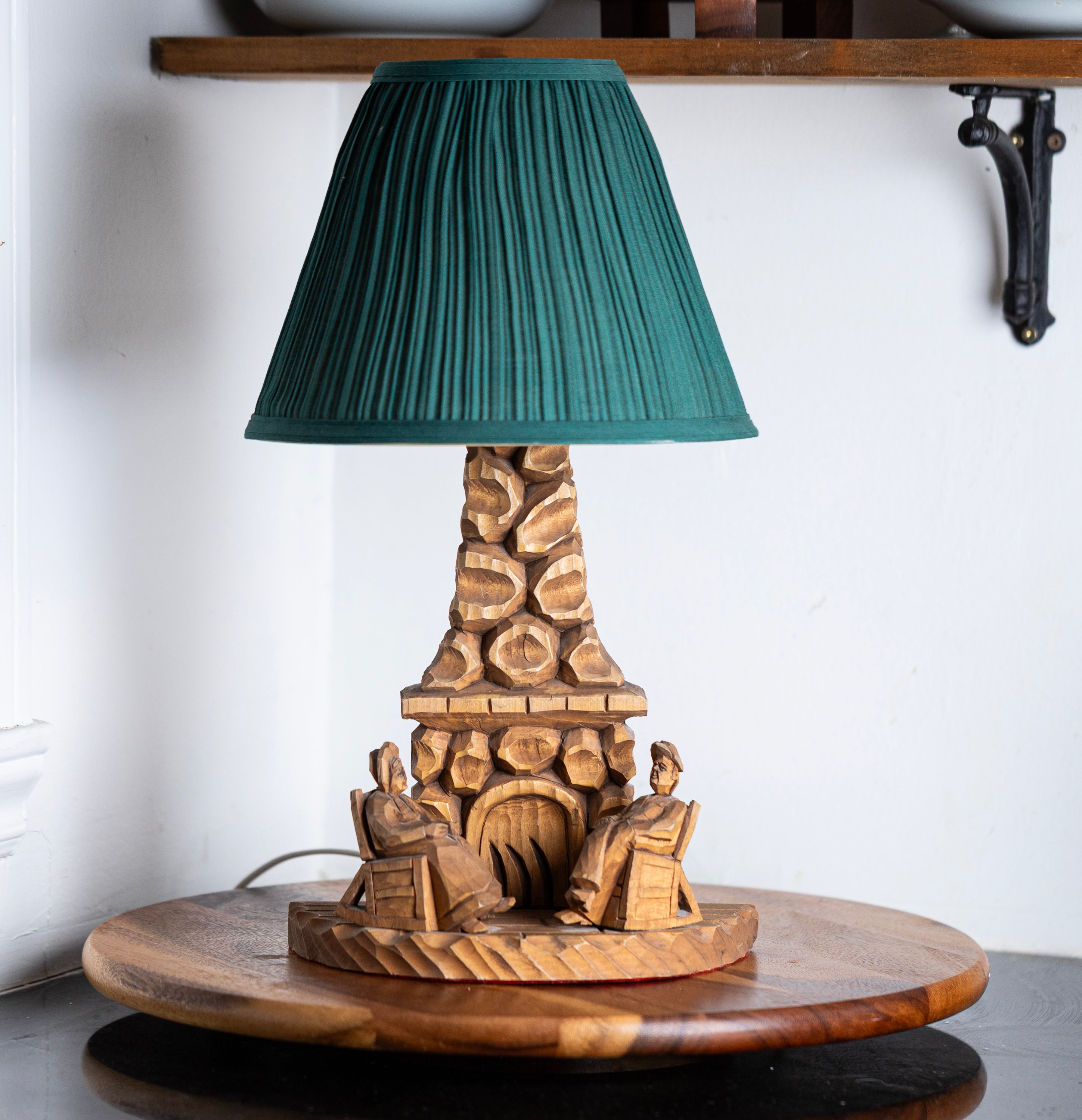 Vintage hand carved wood table lamp with green pleated shade