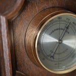 THERMOMETER BAROMETER on wooden background