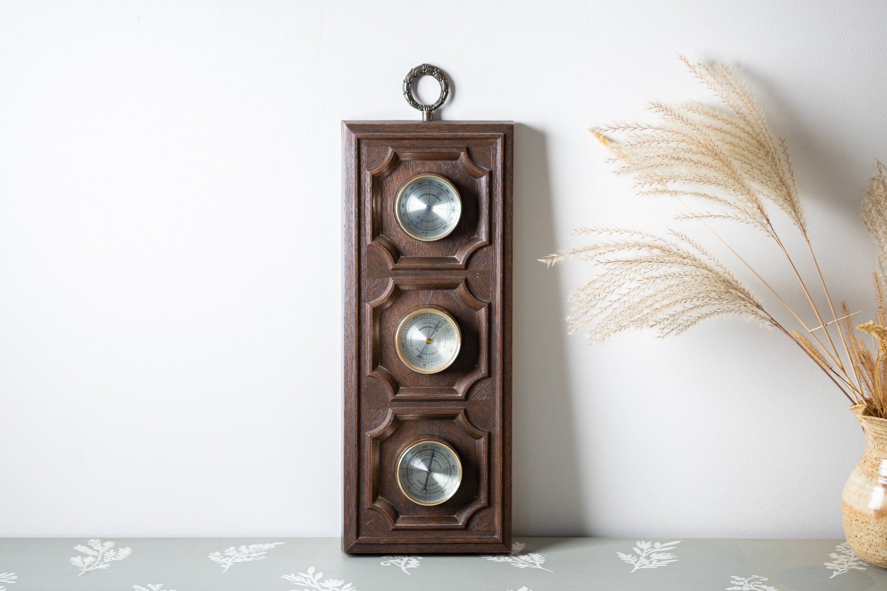 Mid century wooden wall weather station with rustic barometer and thermometer decor