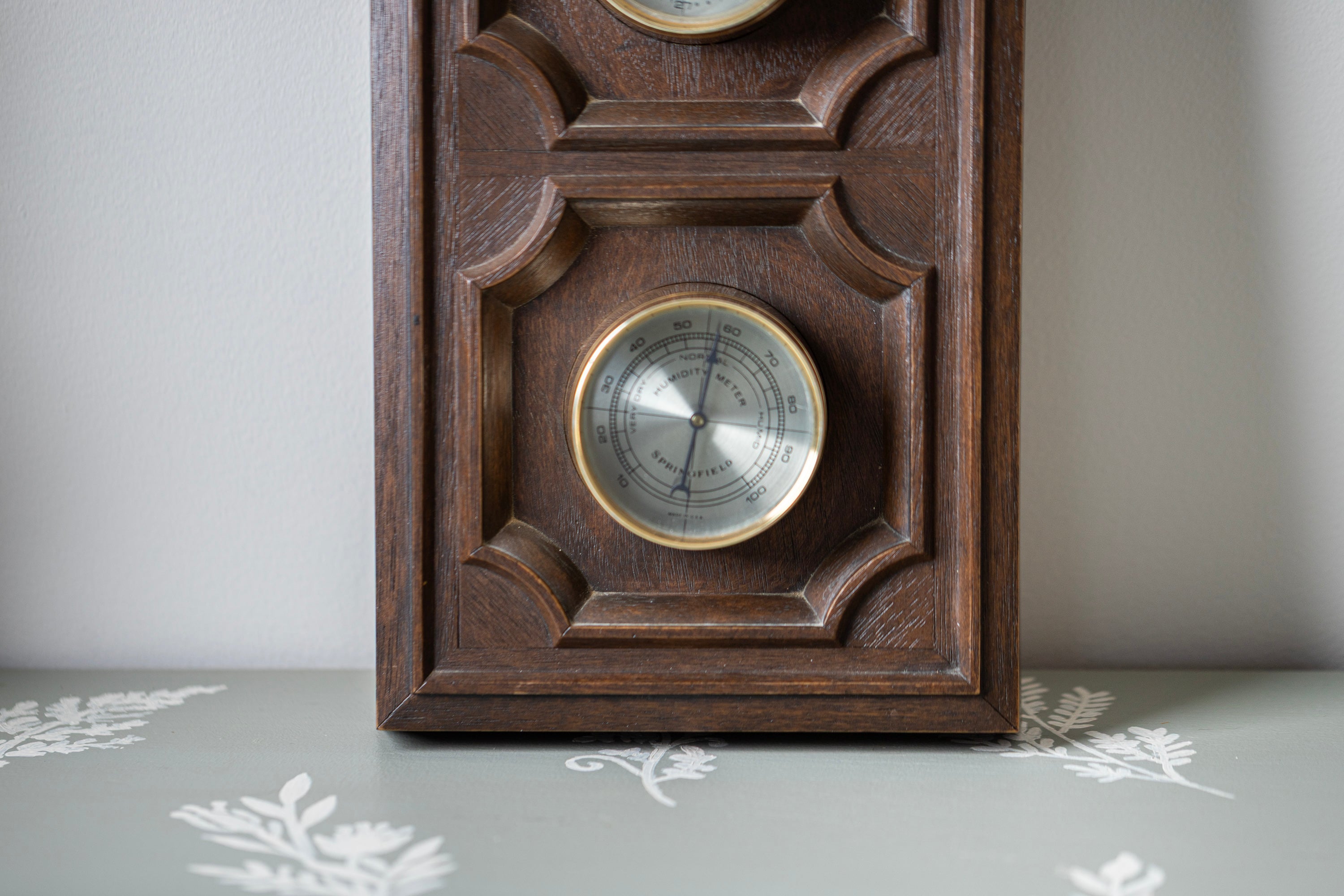 Mid century wooden wall weather station with rustic barometer and thermometer decor