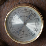 Rustic wooden weather station wall art with barometer and hygrometer details