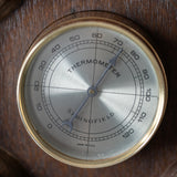 Rustic wooden weather station wall art with barometer and hygrometer details