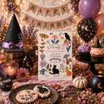 A styled Halloween birthday party scene with a central invitation card reading 'Happy Birthday Michelle' surrounded by candles, a witch hat, cupcakes, balloons, flowers, and a 'HAPPY BIRTHDAY' banner.