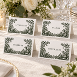 Four woodland wedding food tent cards labeled Appetizers, Salads, Desserts and Beverages on an ivory linen table.